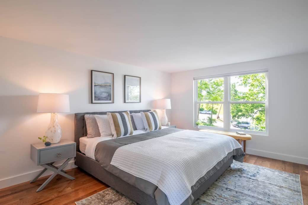 Bedroom on the main floor with a king-sized bed and views of the park.