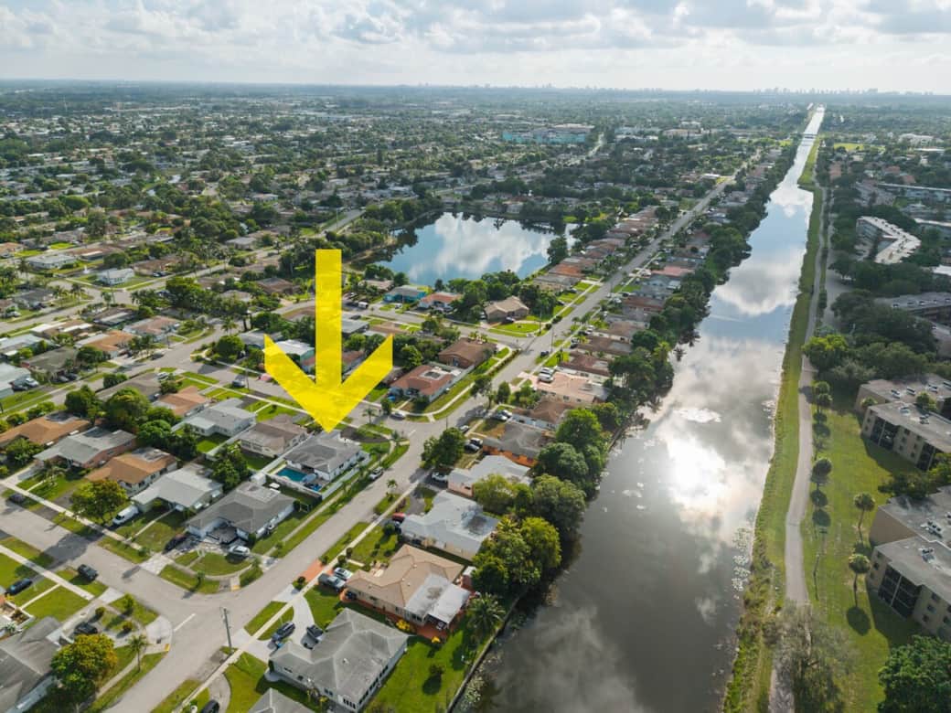 Aerial view showcasing the home’s prime position in a peaceful residential pocket, offering both privacy and convenient access to nearby attractions.