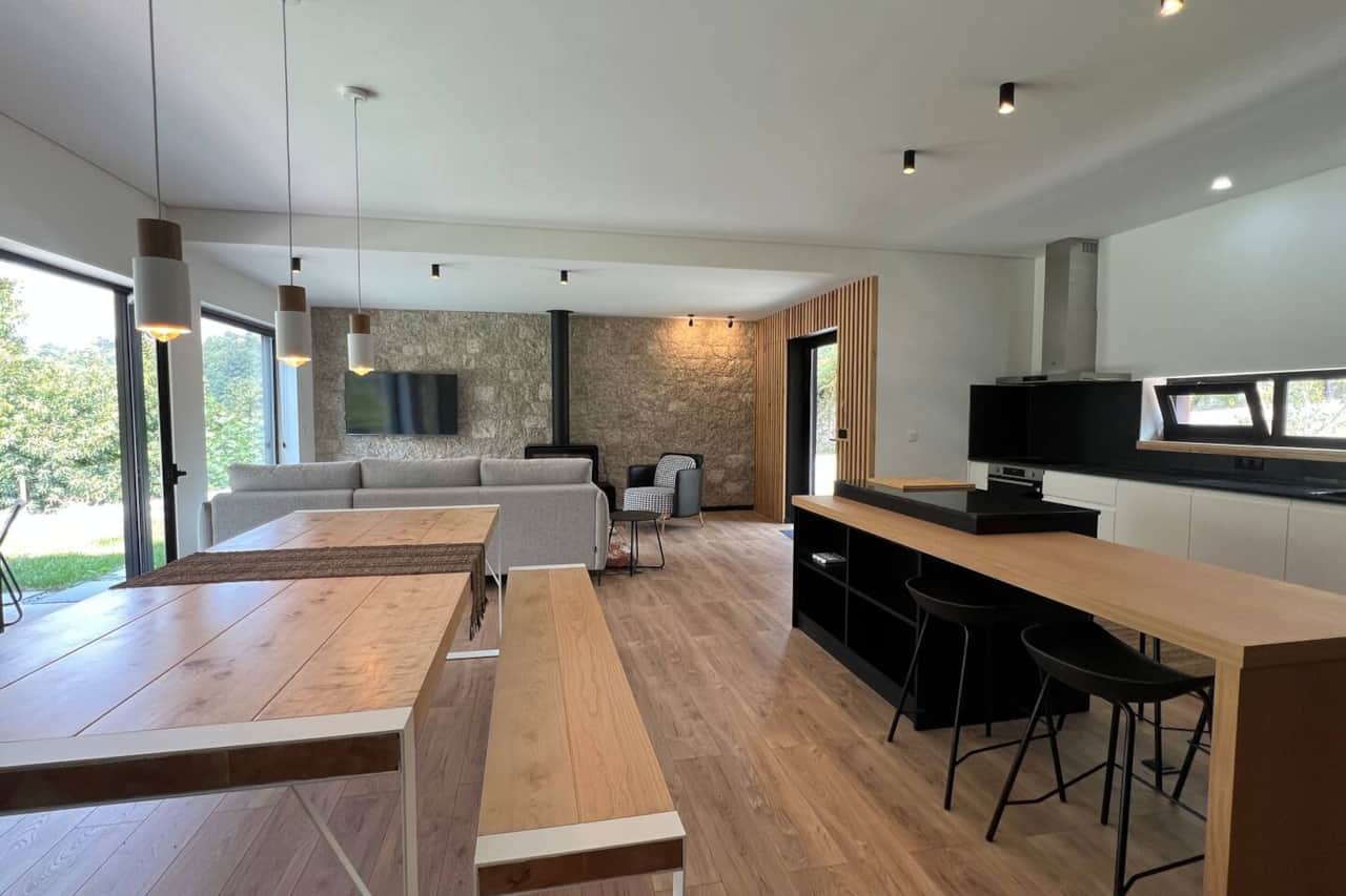 Modern open-plan living room with scenic views at Chestuthill-Geres.