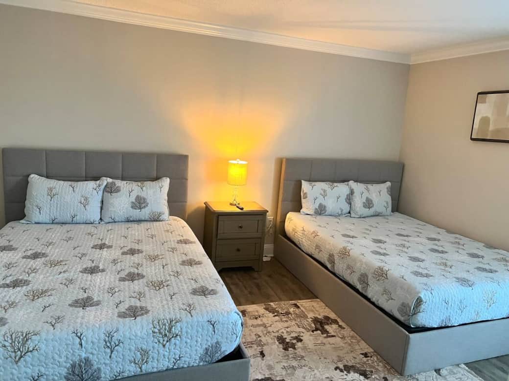 The front bedroom has two queen beds with an ensuite bathroom. The front bedroom has two queen beds with an ensuite bathroom.