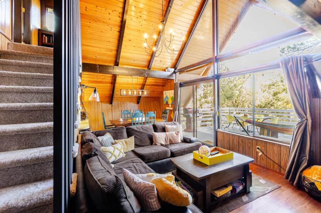 -Soaring 2-story ceiling -Plush sectional -TV with Apple TV (log-on to your accounts) -Wood-burning -Soaring 2-story ceiling -Plush sectional -TV with Apple TV (log-on to your accounts) -Wood-burning