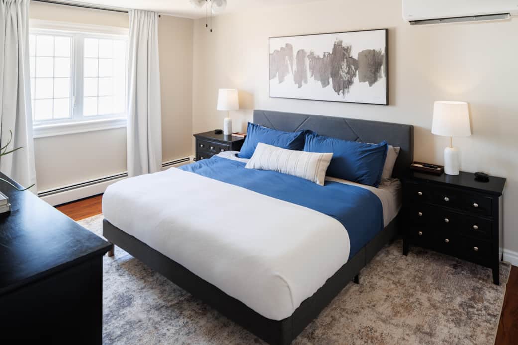 Bright, comfortable master bedroom with king bed