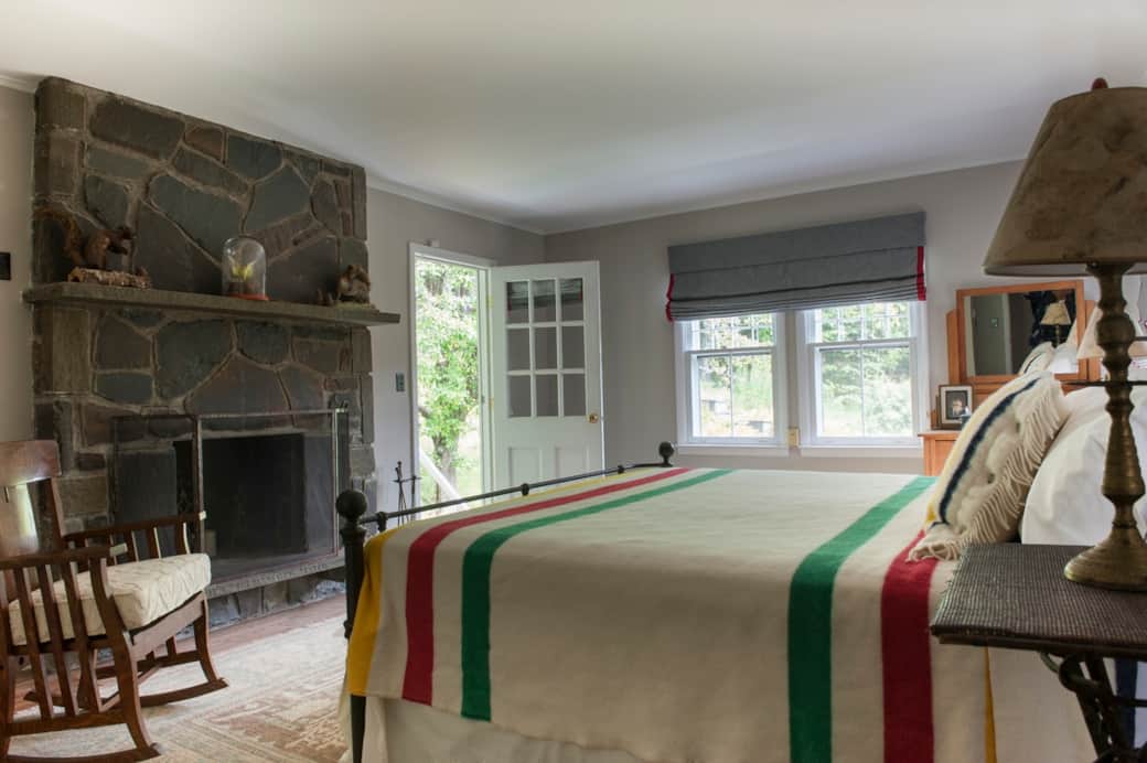 Primary Bedroom with decorative fireplace, beautiful views, and private exit outdoors