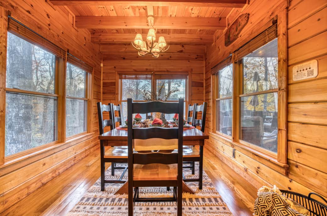 The dining room is surrounded by windows for great ambiance