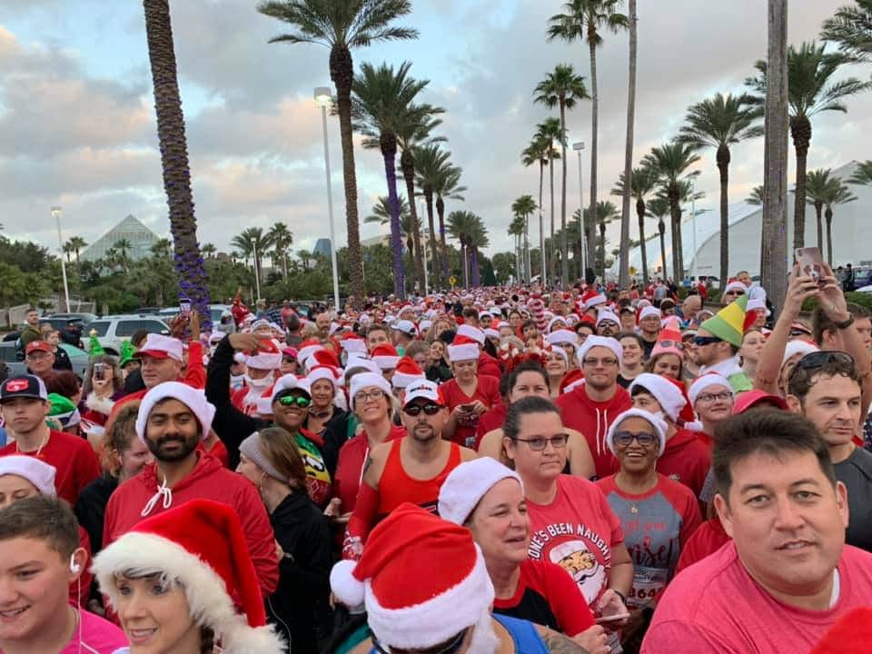 Runners wearing Santa hats during the Santa Hustle race along the Galveston Seawall