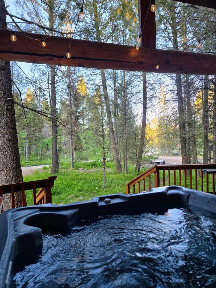 Relax in the hot tub after a long day of adventuring. The hot tub is under the covered deck, making it enjoyable to use during all types of weather.