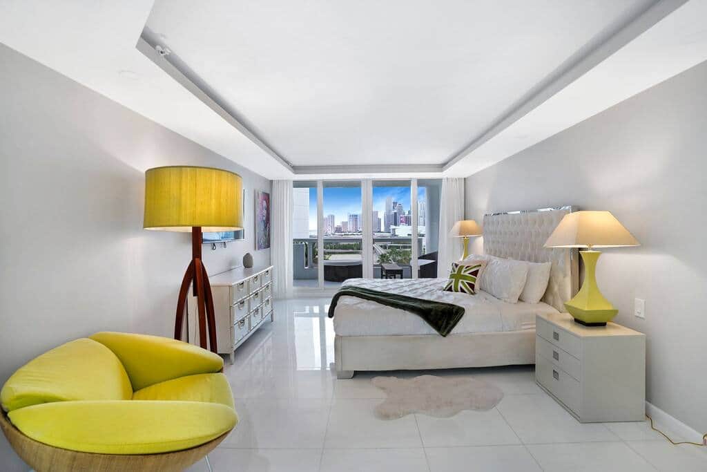 Spacious master bedroom suite, king bed, desk, private bathroom, Roku streaming tv, balcony access
