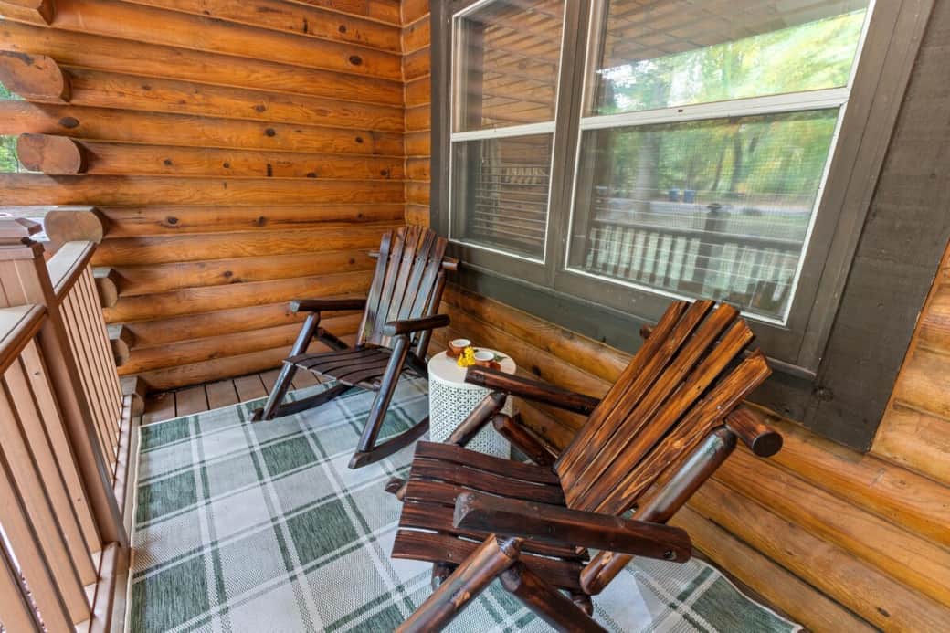 Cozy covered porch with rustic chairs, ideal for morning coffee or unwinding after a day of exploring.
