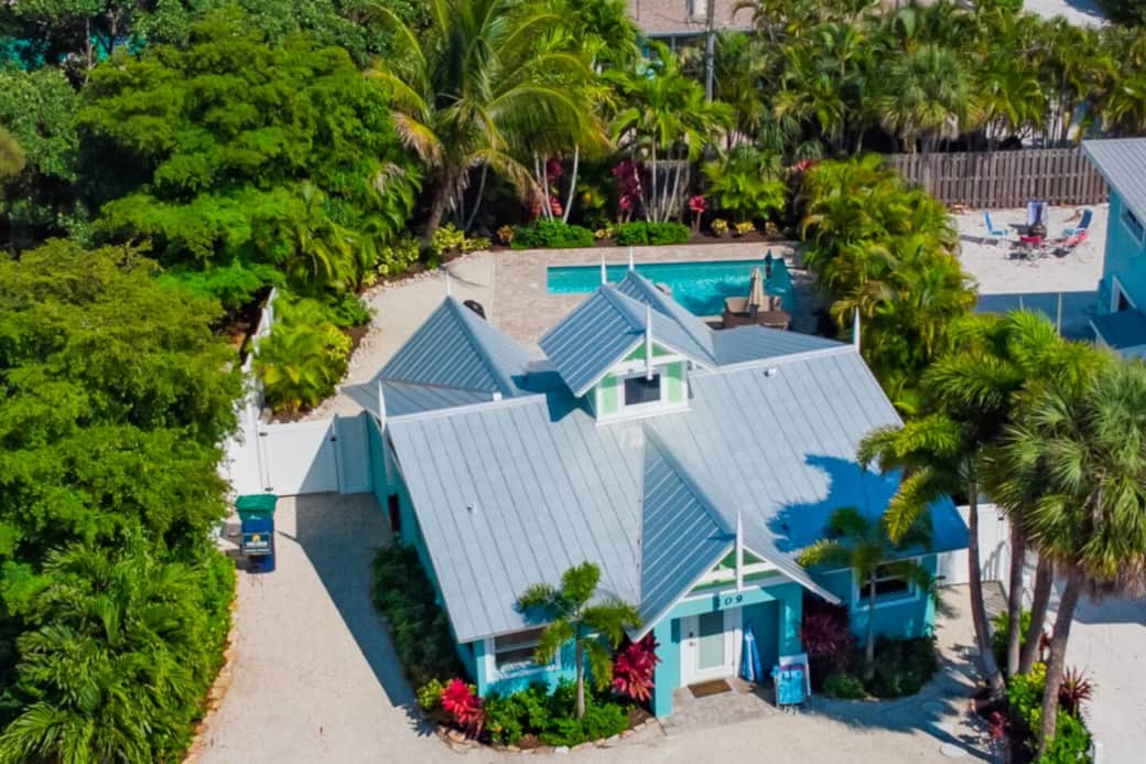 Midday sun warms the AMI cottage and secret pool, cradled by palms—pure island calm for you today!!!