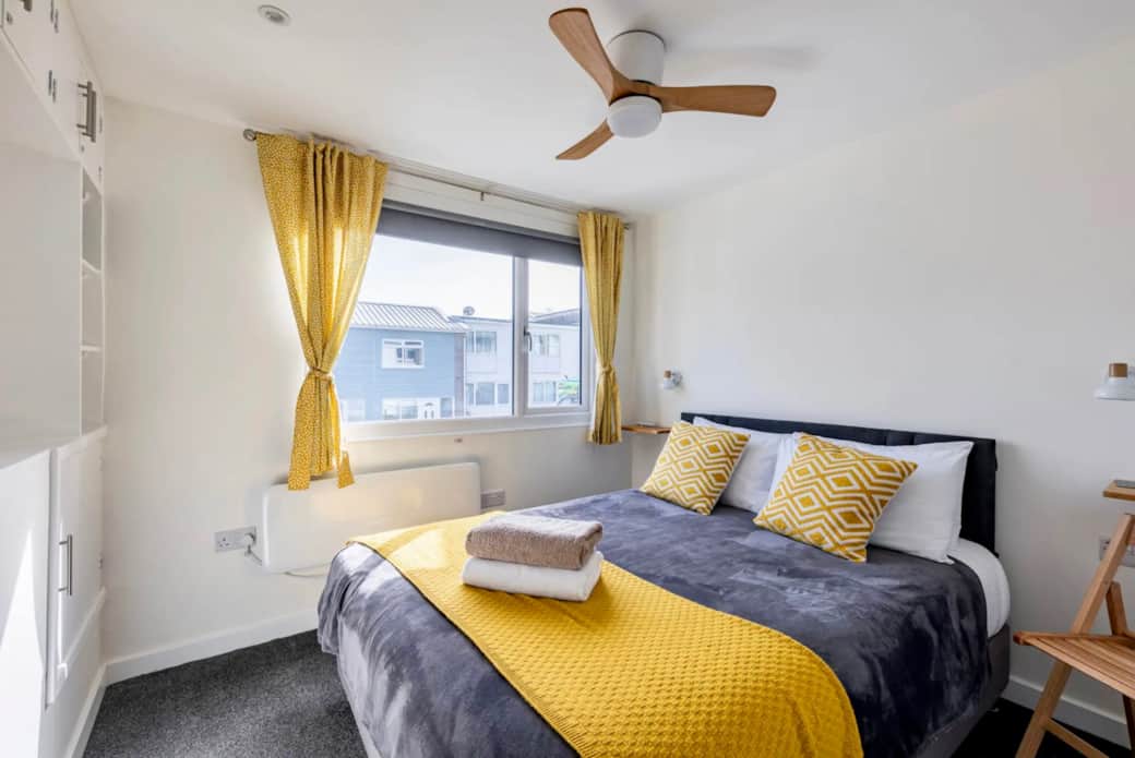 Queen size bed with ceiling fan to keep cool
