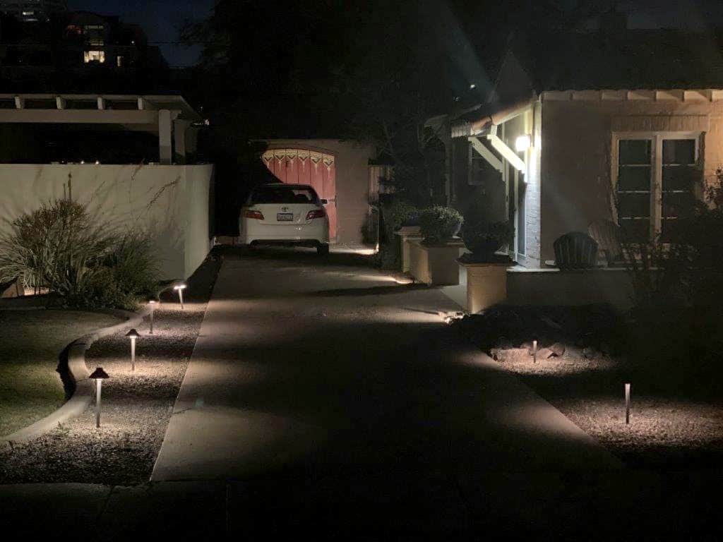 A well lit driveway guides you down the long driveway.