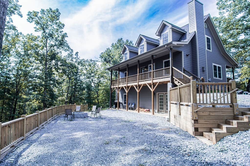 The Farmhouse sits tucked away at the top of a hill surrounded peaceful woods.