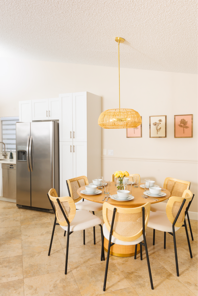 Our dining area features a large table perfect for family gatherings and holiday feasts. Additionally, there's a smaller table in a well-lit corner, ideal for casual meals or morning coffee.