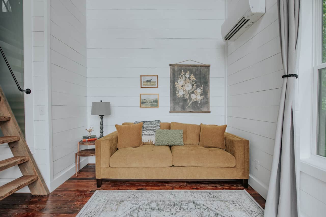 Cozy living room with beautiful reclaimed heart pine floors.