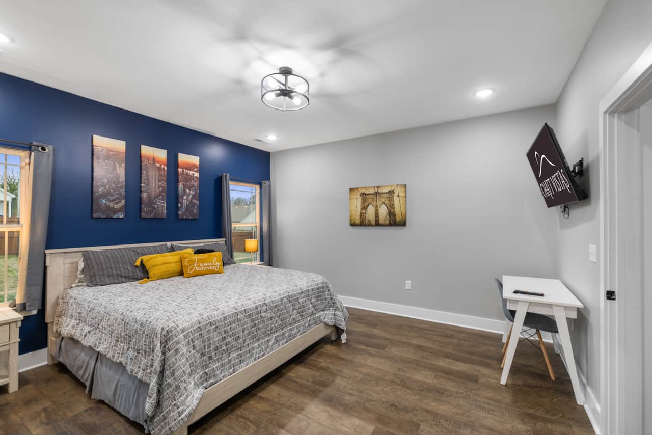 King Master Bedroom Suite with Large 4K Flatscreen, Desk, & (2) Twin 6inch Memory Foam Mattresses