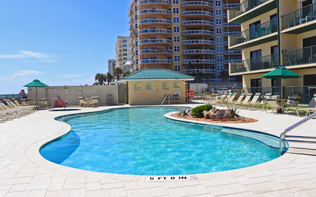 Pool view south, restrooms poolside Pool view south, restrooms poolside