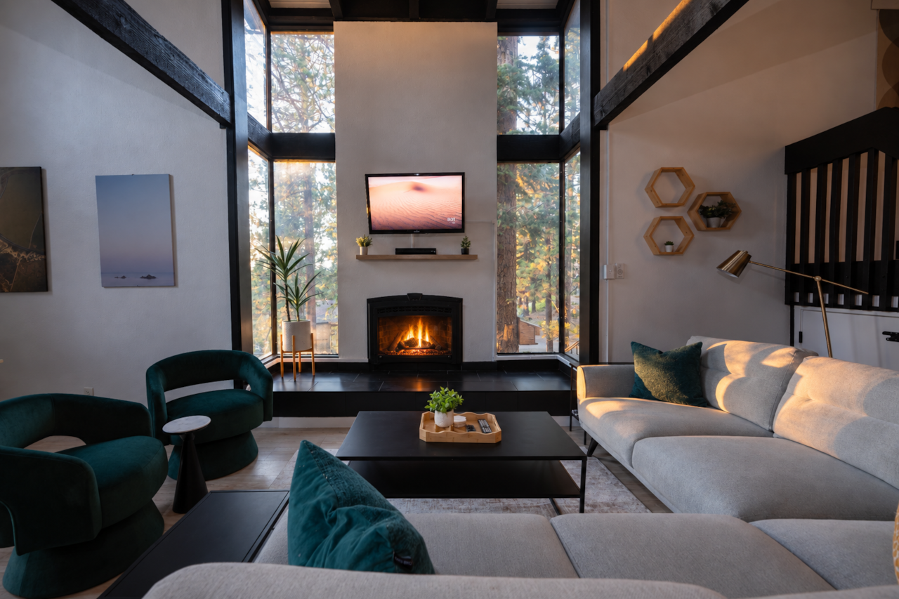 Updated Living room at dusk with gas fireplace.