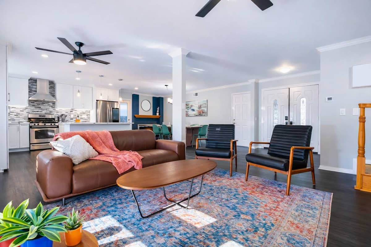 Bright open living space with modern décor and comfortable seating.