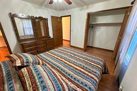 Primary bedroom in quiet rear of building with closet.
