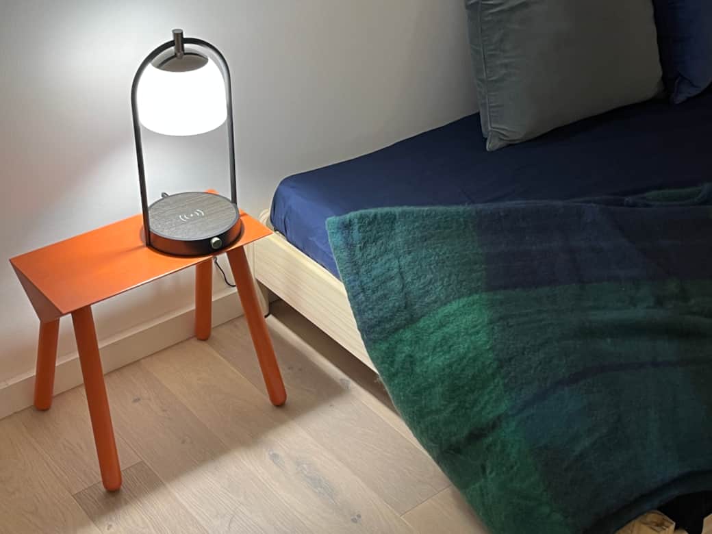 Wireless chargers at the bedside tables in the office. Wireless chargers at the bedside tables in the office.