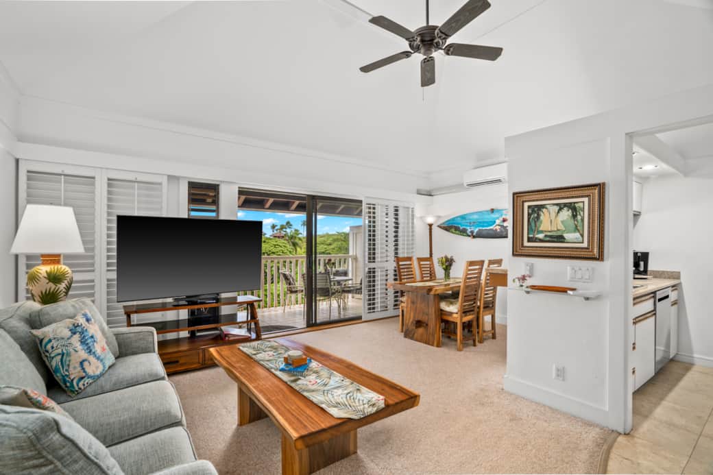 Bright, airy living with balcony views, dining nook, and full kitchen—relax in breezy island vibes.!