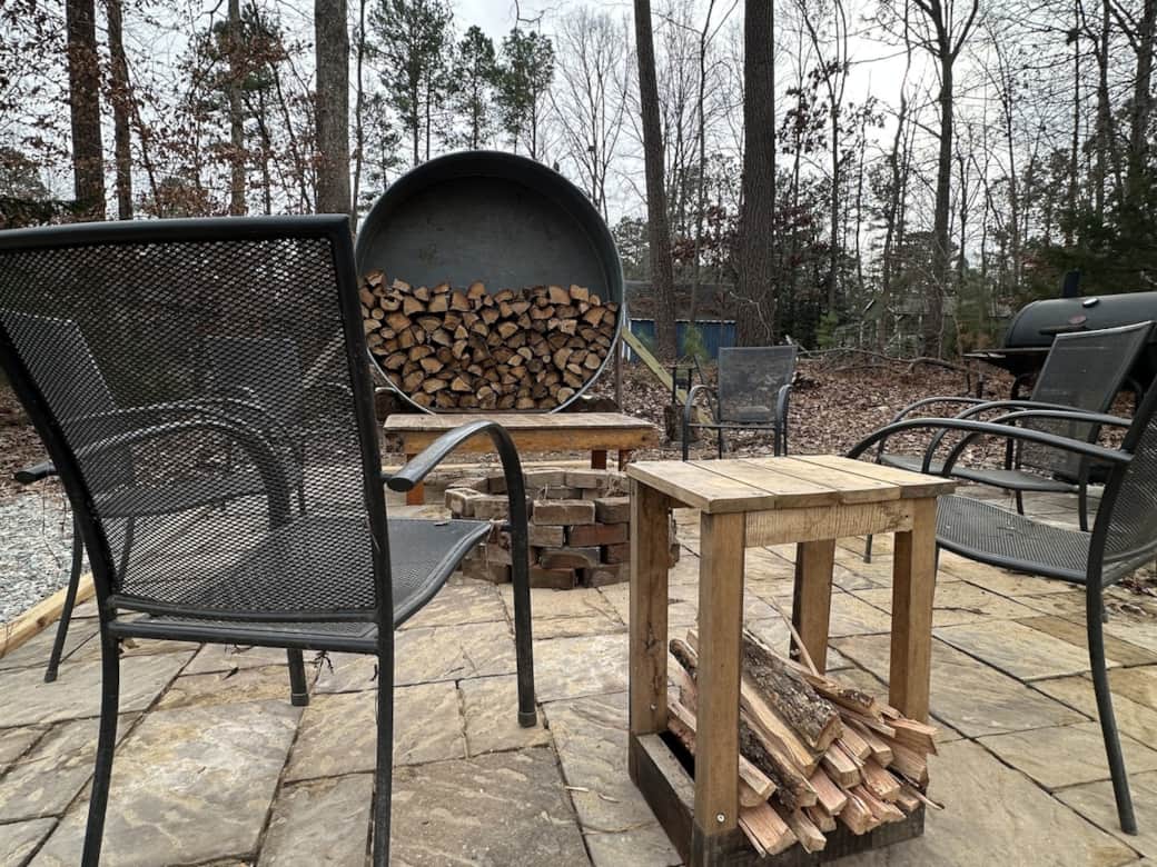 Our new outdoor space has room for a fire pit, grill and smoker, and seating for six. 