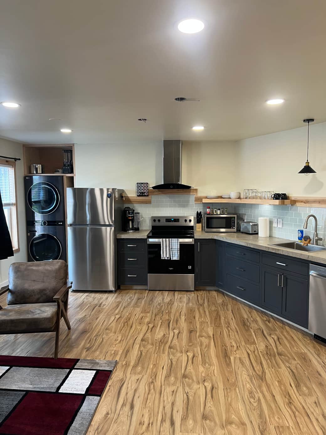 In unit, washer and dryer, full size fridge and cook top.