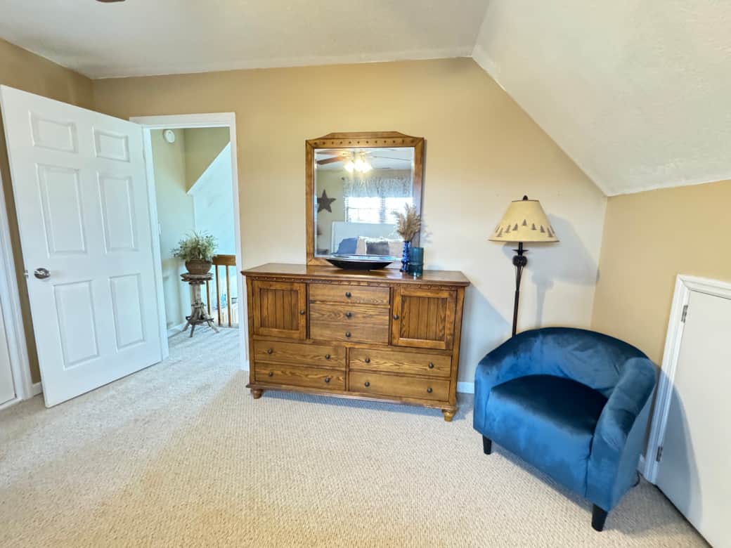 Loft Bedroom with Reading Chair and Dresser