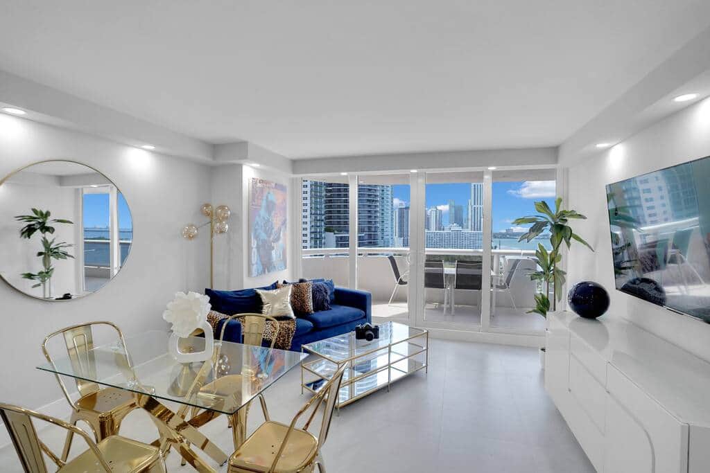 Dining area for 4, living area with Roku streaming tv, balcony access, water views of Biscayne Bay