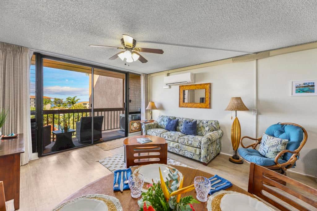 View from the living room and dining area out to the ocean and resort.