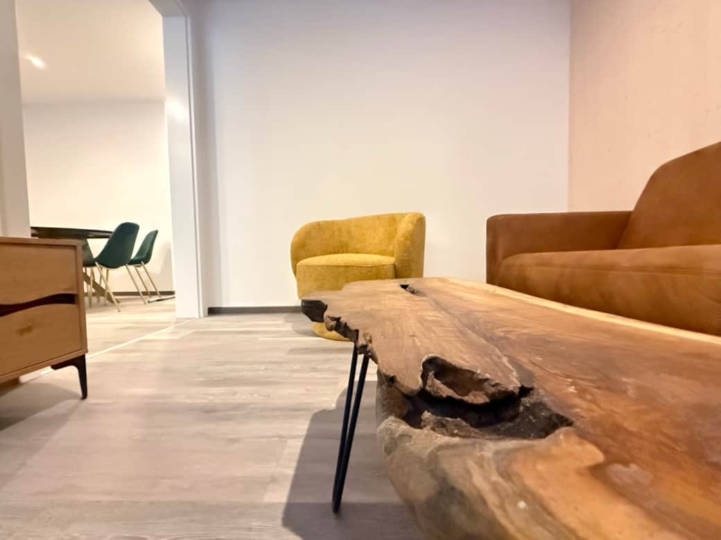 Living room with stylish solid wood table