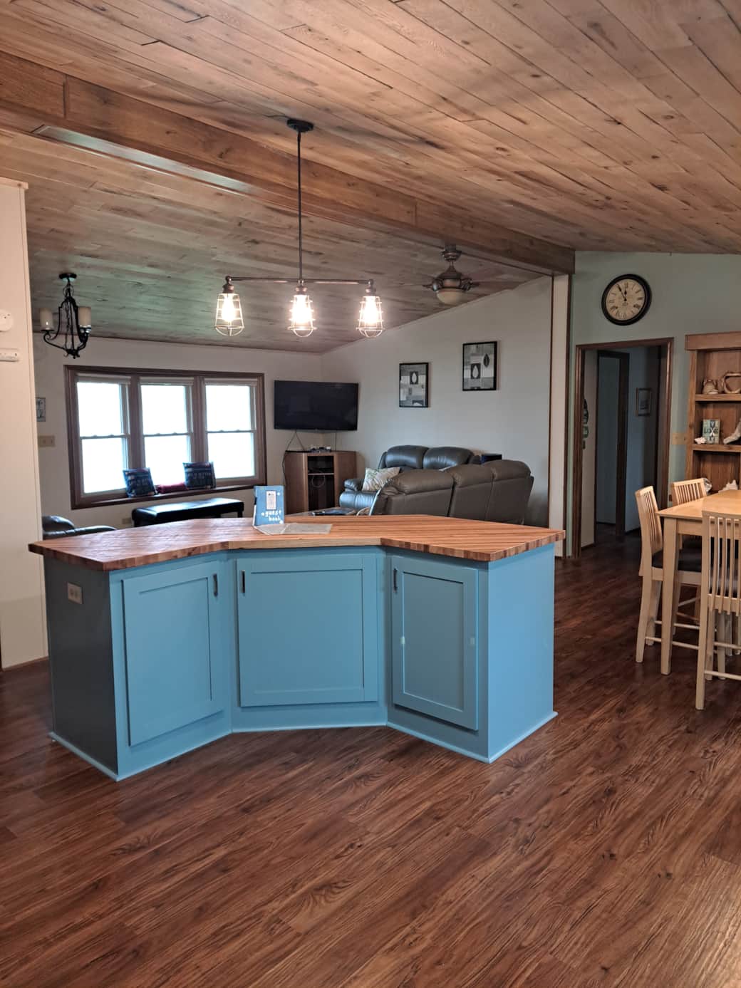 Kitchen looking into living room and dining room