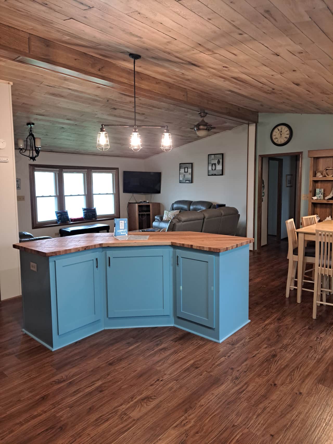 Kitchen looking into living room and dining room
