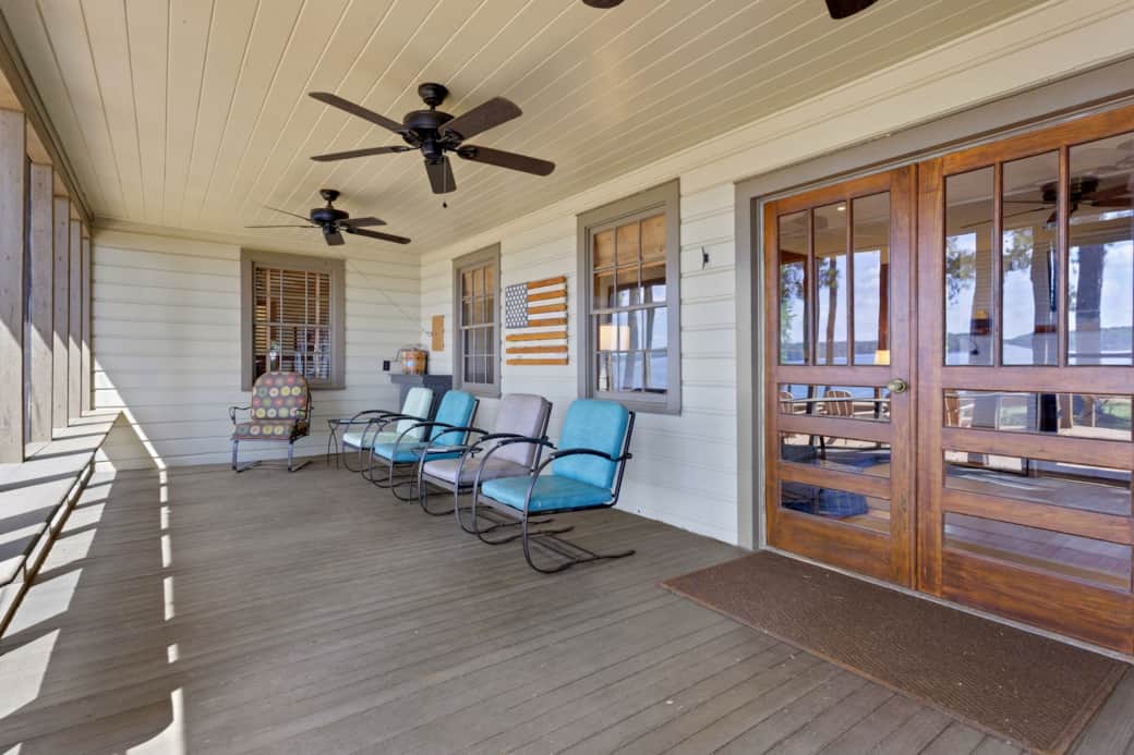 Expansive front porch with lake views