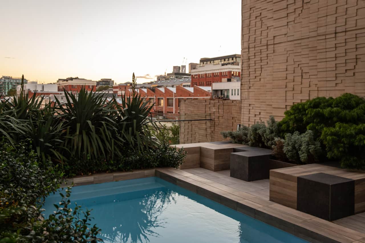The rooftop pool, shared with lovely neighbours and views over the iconic red brick warehouses