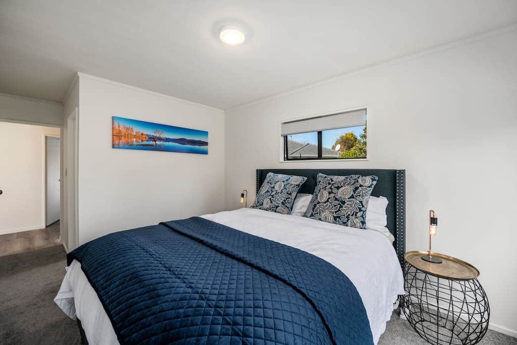The Mandevilla Room—our master bedroom featuring a luxurious king bed and private ensuite.
