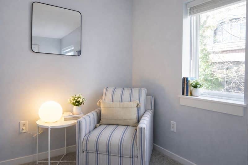Curl up with a good book in this cozy reading nook.