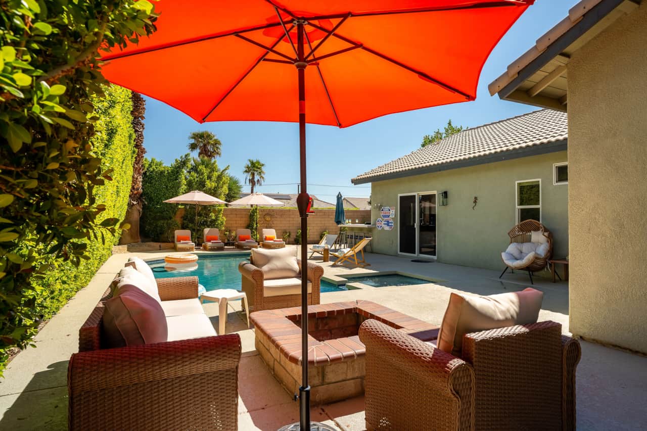 Fire pit w/ comfy sitting and umbrellas
