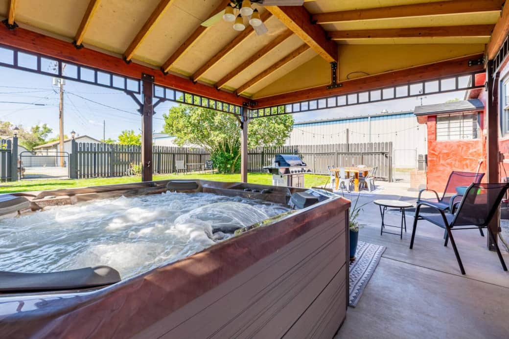 Luxurious hot tub in backyard pavilion