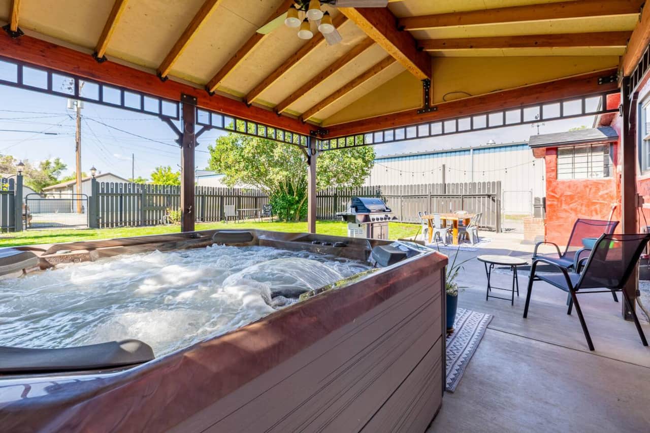 Luxurious hot tub in backyard pavilion