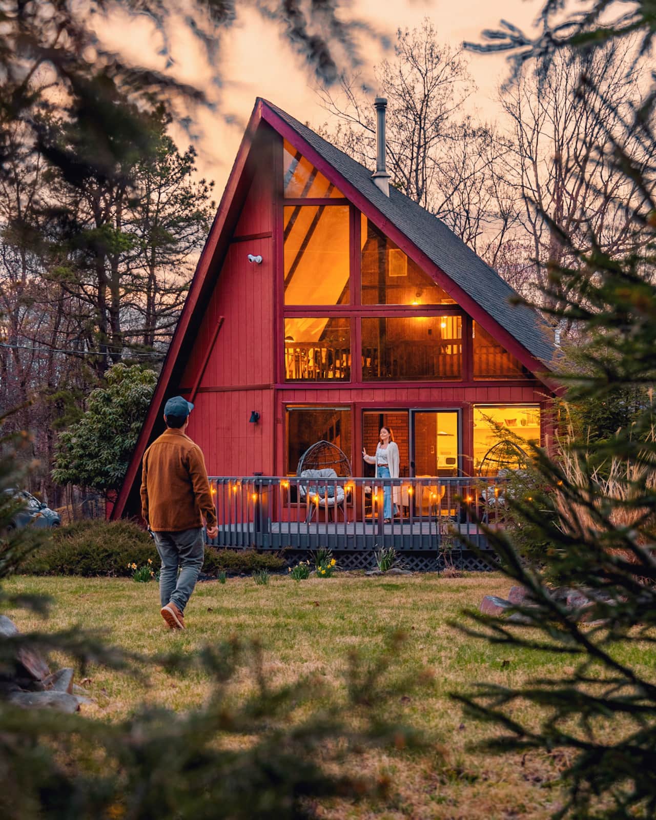 Escape to a glowing A-frame chalet tucked among the trees in the Pocono Mountains. 