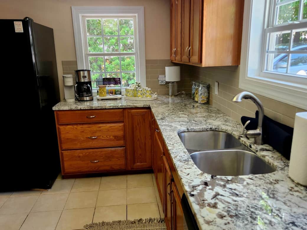 A thoughtfully stocked kitchen with space to prepare morning coffee, light bites, or celebratory meals before the big day.