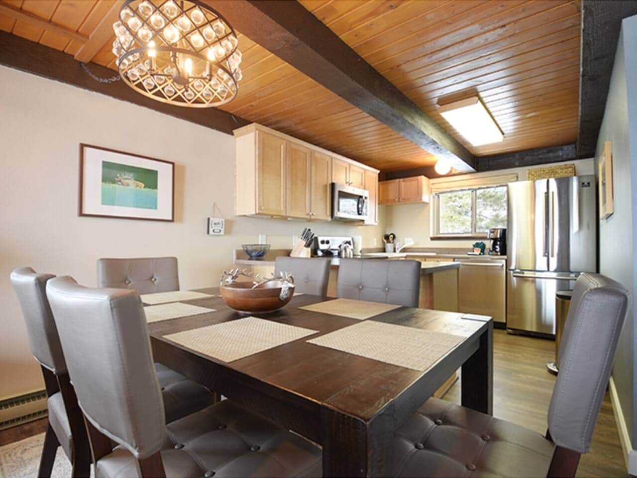 Cook, connect, and unwind in a bright open space with scenic mountain views.