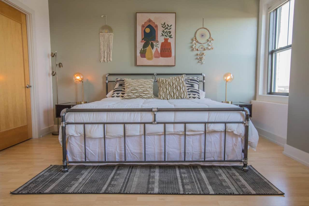 King bed with memory firm foam mattress.  Nightstand lamps include wireless charging.