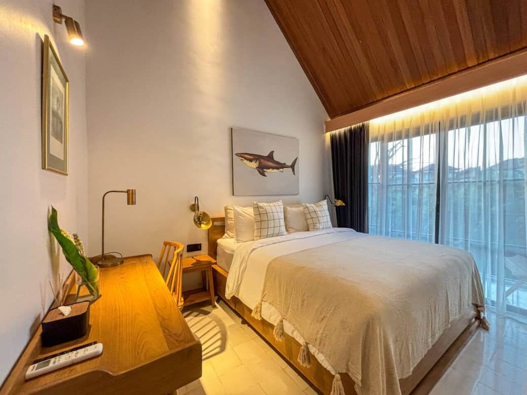 Bedroom 2 - Bedroom 2 opens to a balcony overlooking the pool, the temple, the creek, and tropical gardens.