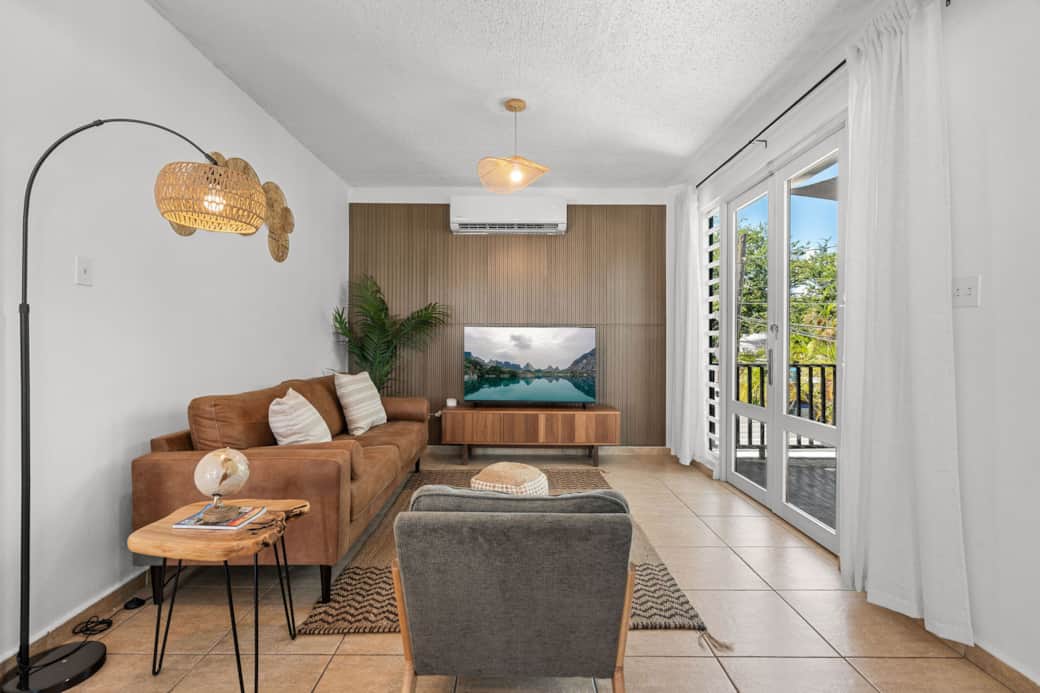 Comfortable lounge space with natural textures and smart TV