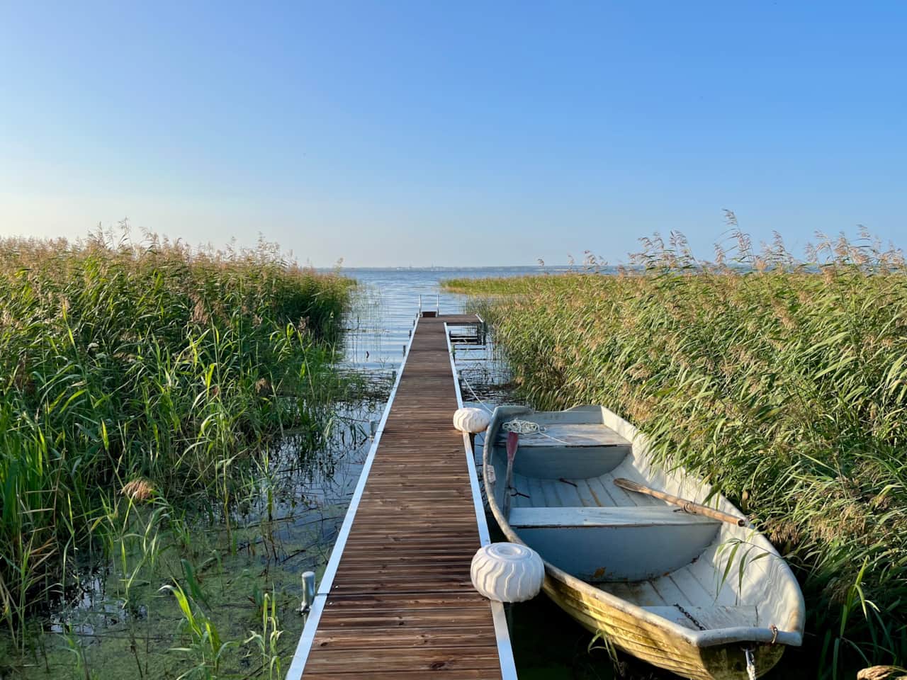 Private pier with rowboat. The boat shown has since been replaced with a newer aluminium rowboat.