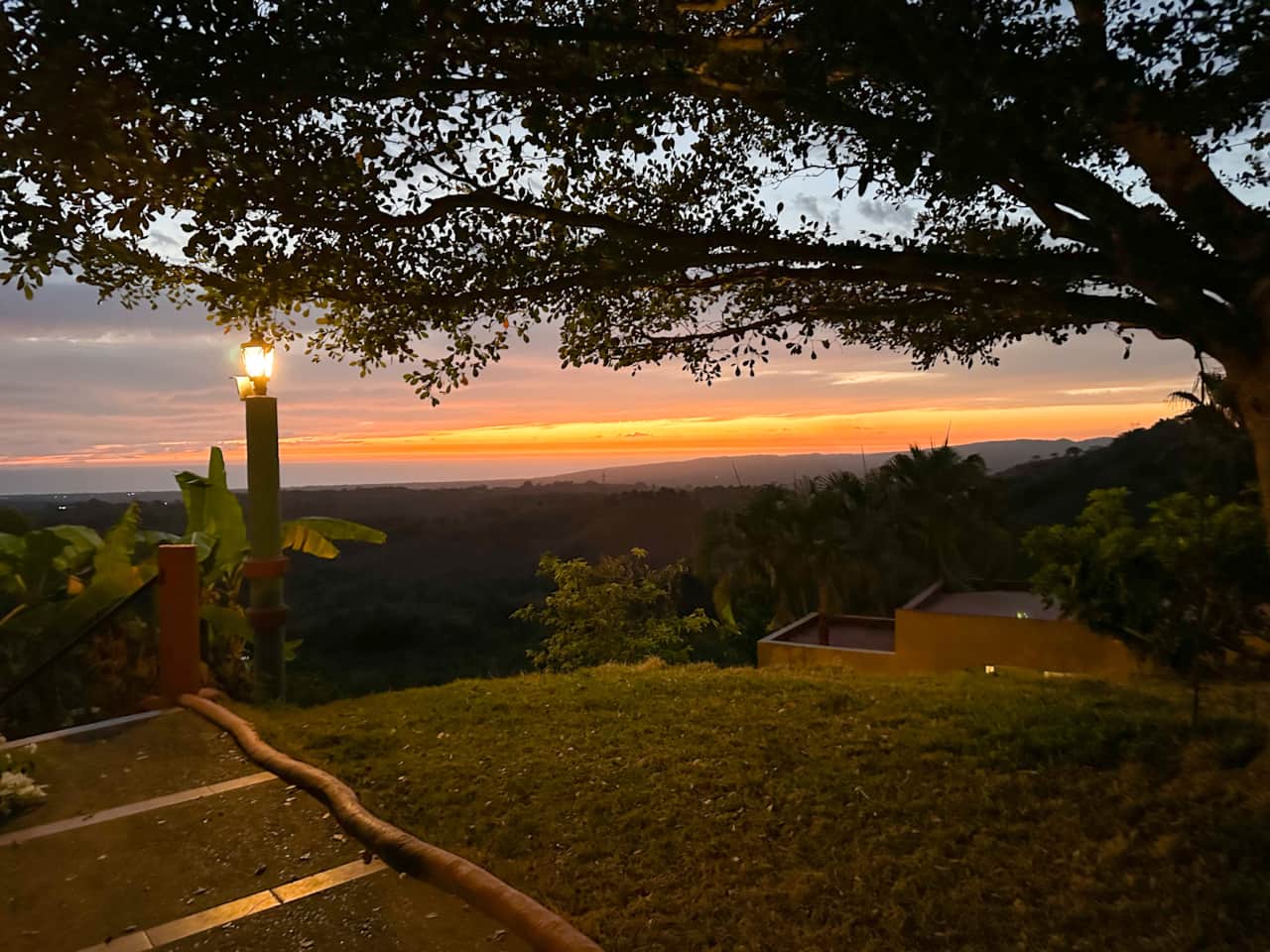 Grassy level of the property. La Casa Chilam in the bottom right hand side.