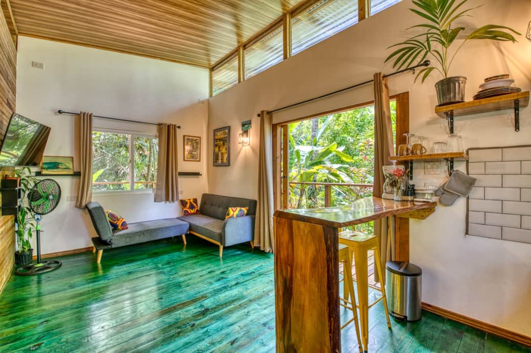 Open-plan living with jungle views, handcrafted bar & vibrant hardwood floors — the ideal tropical island getaway in Bocas del Toro. Surf, relax & recharge.