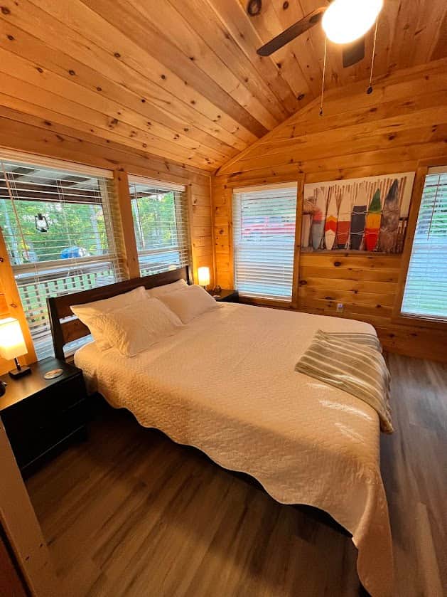 Second bedroom with TV and desk space.